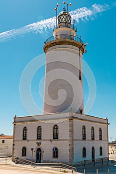 The lighthouse of Malaga harbour. Work began in 1816