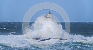 Lighthouse of the mangiabarche of calasetta in a stormy day, sardinia