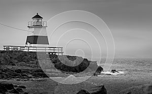 Lighthouse in Margaretsville, Nova Scotia. Overcast spring day in the Bay of Fundy.