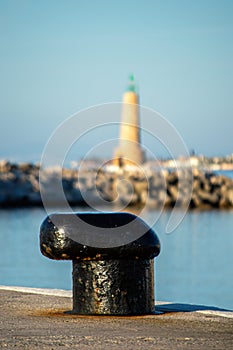 Lighthouse in marina on sunrise in Banus, Marbella, Spain