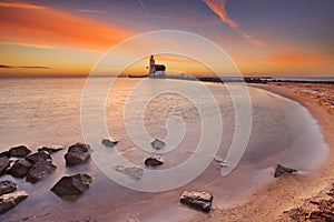 Lighthouse of Marken in The Netherlands at sunrise photo