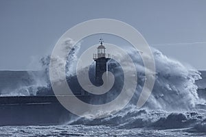 Lighthouse in the middle of stormy waves