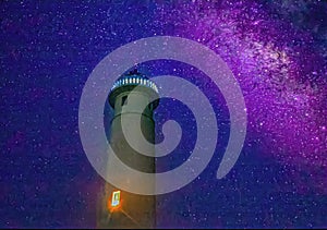 Lighthouse at midnight accompanied by the Milky Way