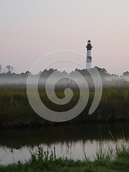 Lighthouse in the morning mist photo
