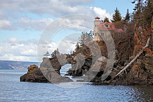 Lighthouse at natural arch near Halibut Cove in the Kachemak Bay Homer Alaska USA