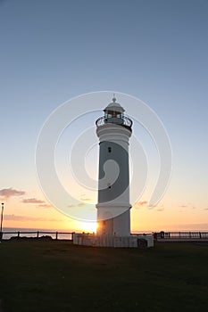 Lighthouse near the blowhole in Kiama, South Coast NSW, Australia at a colorful sunrise