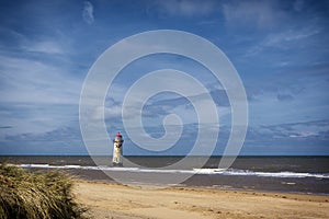 The lighthouse on the nearby beach and the Talacre Beach