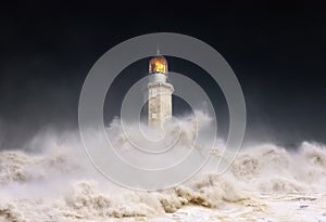 Lighthouse at night with storm