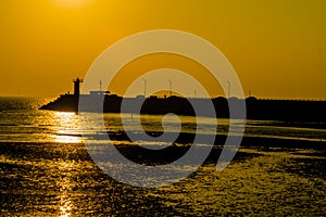 Golden sunset reflecting in ocean waves