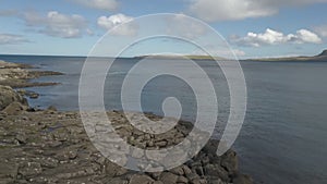 Lighthouse and old coastal fortifications with artillery on Faroe Islands