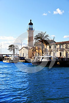 Lighthouse and old fishing port of Grau du roi in Camargue zoological nature reserve. South of France.