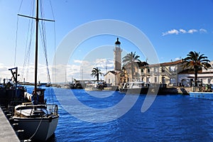 Lighthouse and old fishing port of Grau du roi in Camargue zoological nature reserve. South of France.