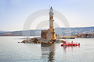 Lighthouse in old harbour of Chania on Crete