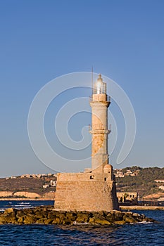 Lighthouse and old Venetian port of Chania, Crete in the late evening sun