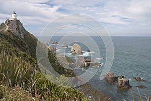 Lighthouse overlooking rocks