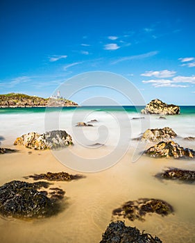 Lighthouse Panorama beach sea view in Ireland ocean coast.