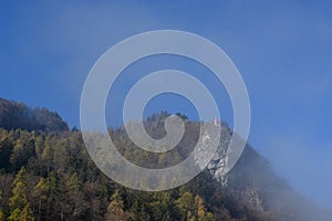 Lighthouse on peak of mountain on foggy morning in Alps, Bad Ragaz