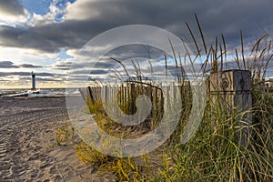 Lighthouse and pier on Lake Huron under a stormy sky - Ontario,