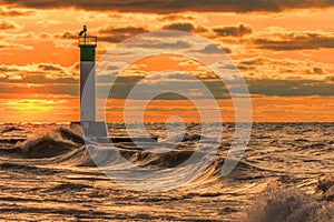 Lighthouse and pier on Lake Huron under a stormy sky - Ontario,