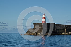 A lighthouse on a pier in Ponta Delgada photo