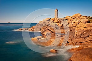 Lighthouse of Ploumanach at the golden hour in Perros-Guirec, Côtes d\'Armor, Brittany France