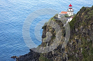 Lighthouse on Ponta do Arnel, Nordeste, Sao Miguel Island, Azores Islands, Portugal. photo