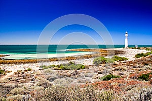 Lighthouse on the quite turquoise beach at point lowely in Australia