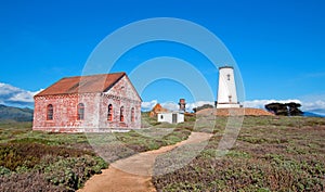 Lighthouse and red brick fog signal building at Piedras Blancas point on the Central California Coast north of San Simeon Californ