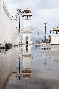 Lighthouse reflection in water, Baan Bang Bao fisherman village on Koh Chang island, Thailand