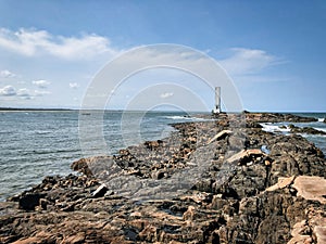 Lighthouse with rock formation in Itacare - Bahia Brazil