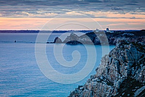 Lighthouse on Rocky Cliff