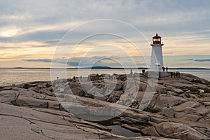 A lighthouse on a rocky out crop