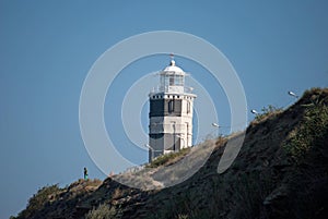 Lighthouse on a rocky seashore