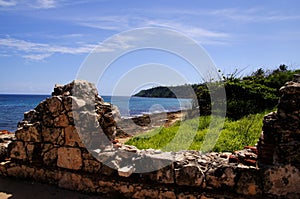 Lighthouse ruins and beach photo