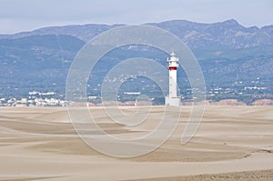 Lighthouse and sand dunes in Punta del Fangar (Spain)