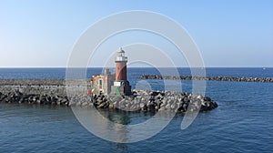 Lighthouse on the sea in the morning. photo