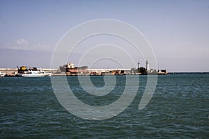 Lighthouse in the sea, ship