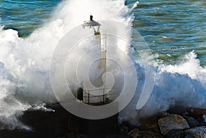 Lighthouse during a seastorm photo