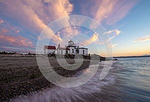 A lighthouse in Seattle at sunset