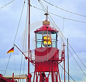 Lighthouse ship in harbor