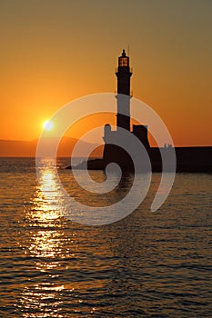 Lighthouse silhouette at sunset