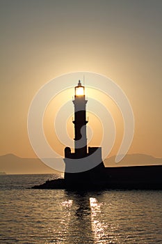 Lighthouse silhouette at sunset