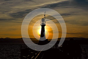 Lighthouse silhouette at sunset