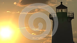 Lighthouse silhouetted by beaming sun