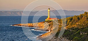 Lighthouse Stoncica at sunset light on island Vis, Croatia