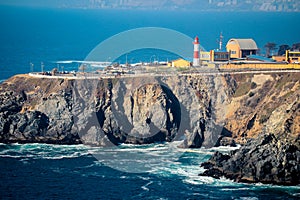 Lighthouse on the Stone Rocks of the Pacific Ocean Coastline near Vina del Mar, Chile