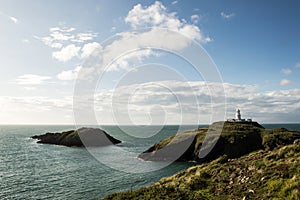 The lighthouse at Strumble Head, surrounded by the wild coastline of Pembrokeshire. Wales.