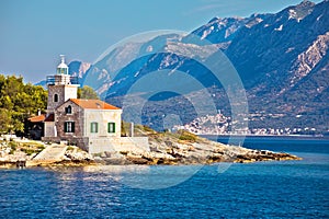 Lighthouse of Sucuraj on Hvar island and Biokovo mountain background view