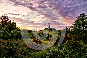 lighthouse in summertime sunset