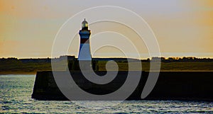 Lighthouse at the entente Fraserburgh Harbour, Aberdeenshire, Scotland, UK photo